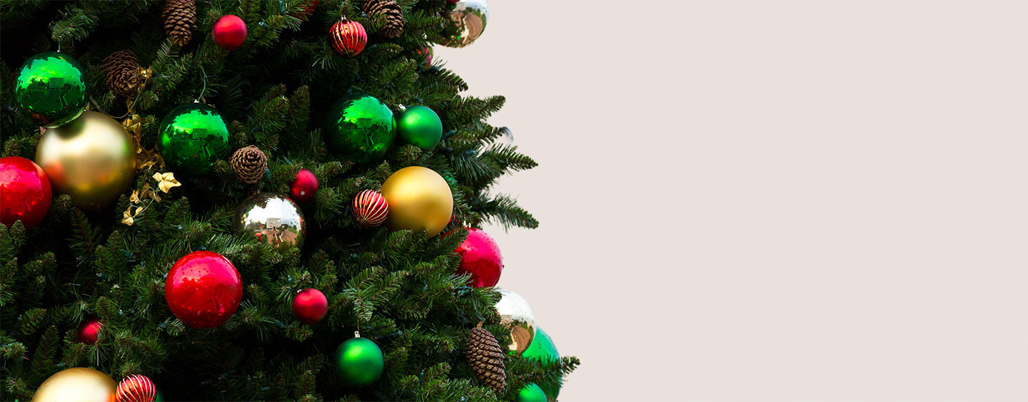 A close up of a Christmas tree decorated with various ornaments