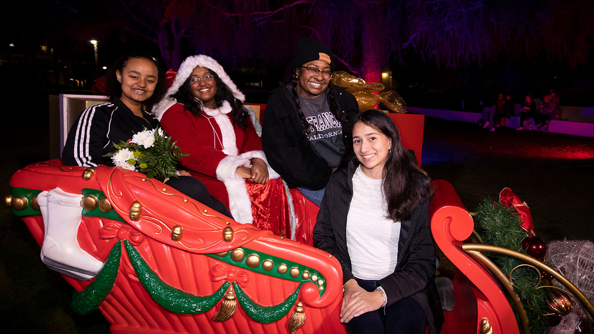 Several students sitting in a sleigh