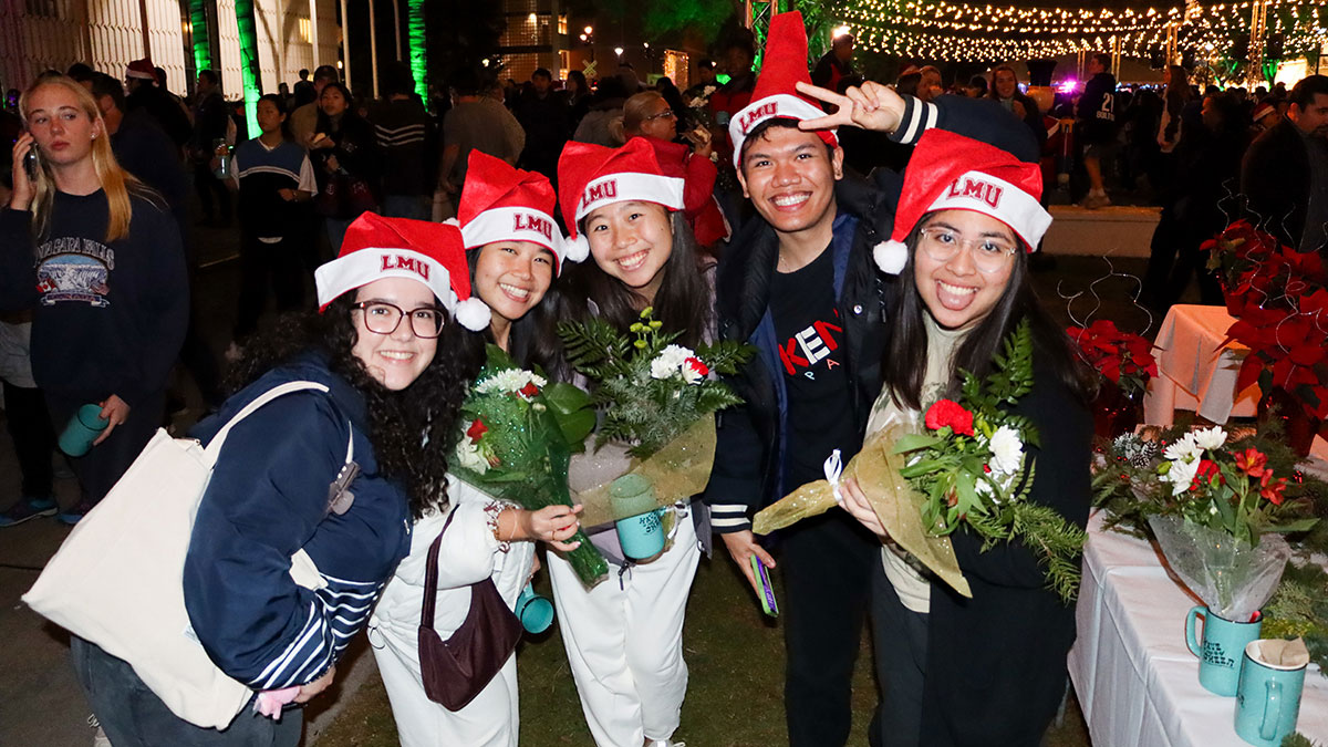 Group of students wearing santa hats