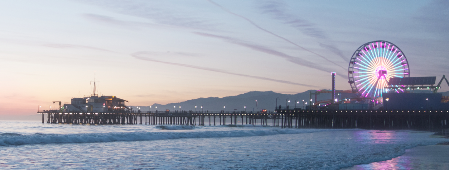 Santa Monica pier in Los Angeles at sunset.