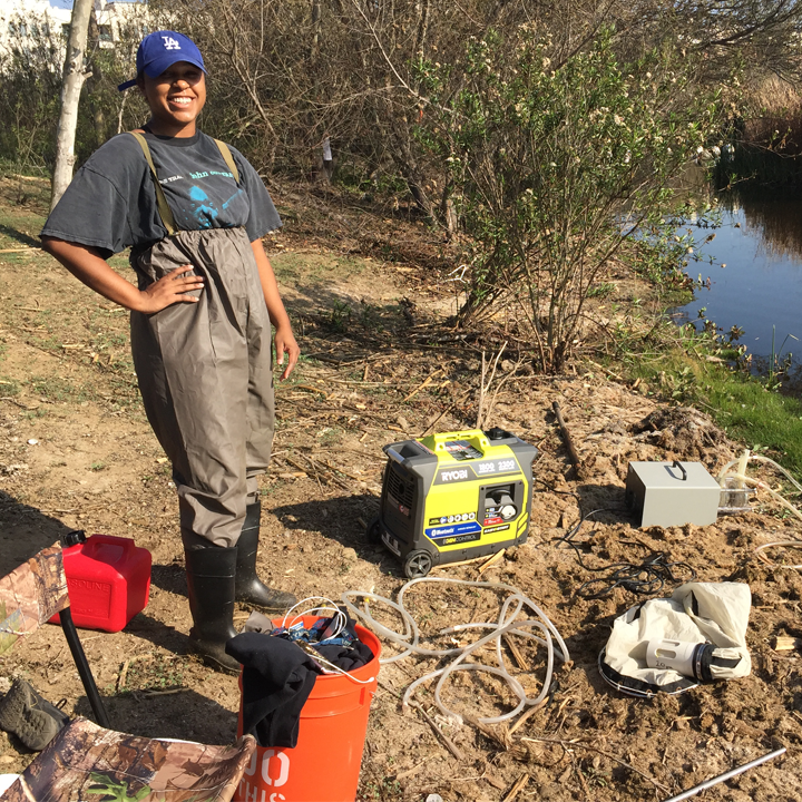 A student doing environmental work near the LMU campus.