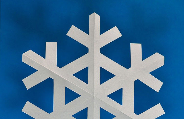 A paper cutout of a snowflake