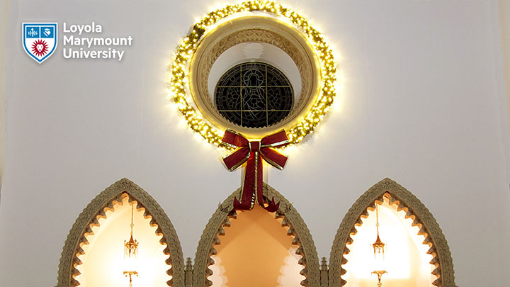 Large wreath around the exterior of the Rose Window above the Sacred Heart Chapel entryway