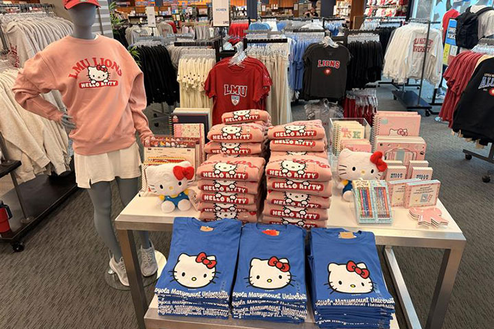 A table at the LMU bookstore showcasing a variety of Hello Kitty branded merchandise