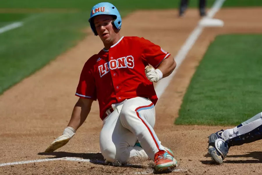 LMU Lions Baseball player slides to base