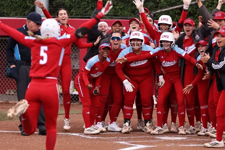 LMU Softball players celebrate their victory over Pacific together
