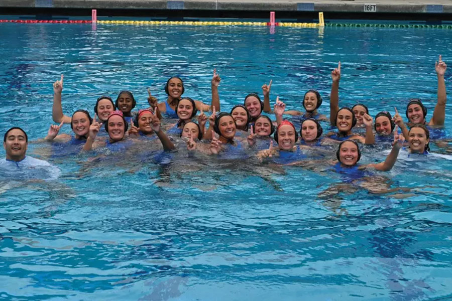 LMU Women's Water Polo Team holds up number ones in the pool