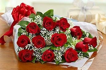 A bouquet of red flowers laid on a table