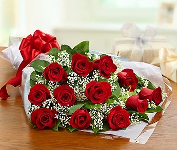 A bouquet of red flowers laid on a table