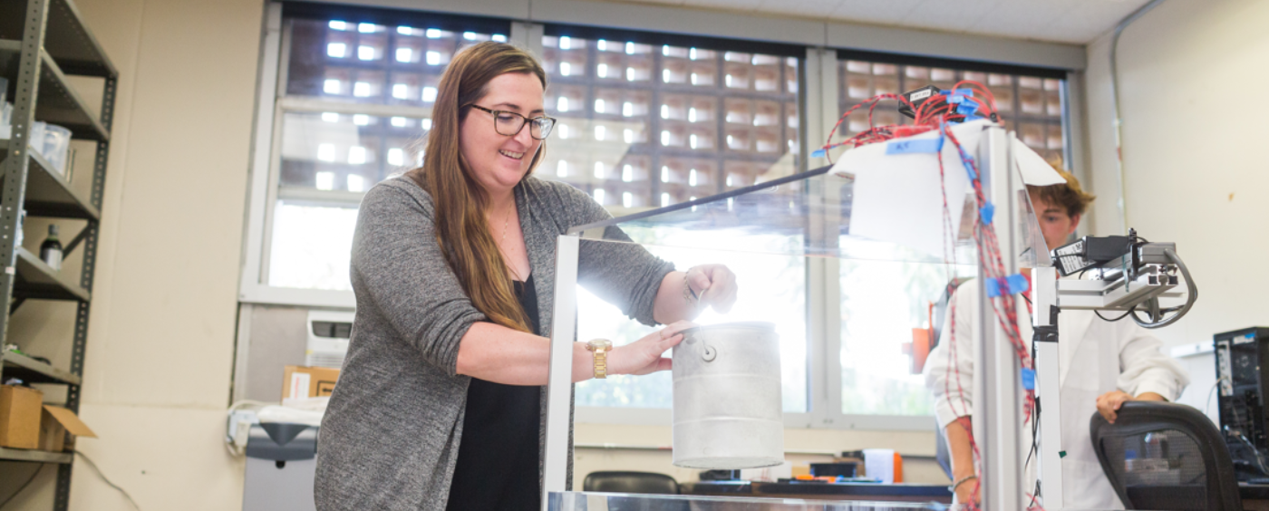 LMU Professor Emily Hawkins in the Lab with a student