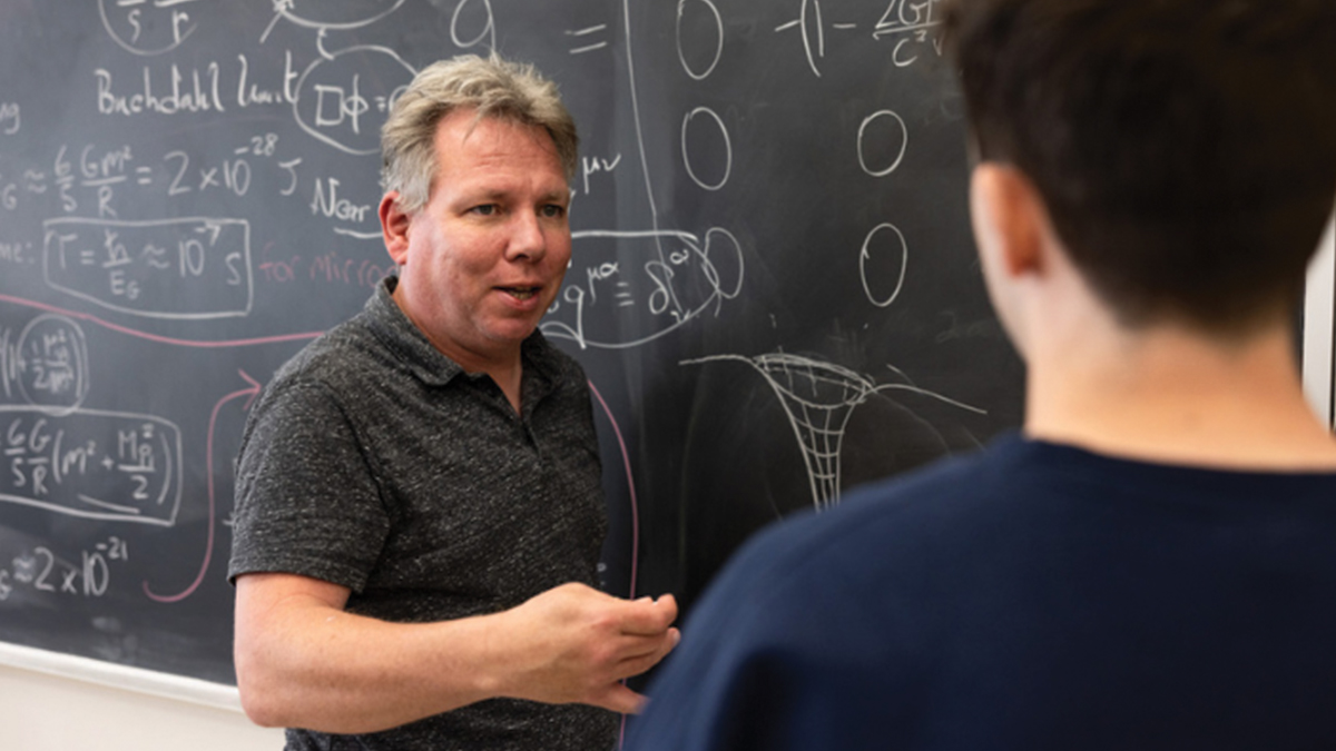 LMU Professor Jonas Mureika with student