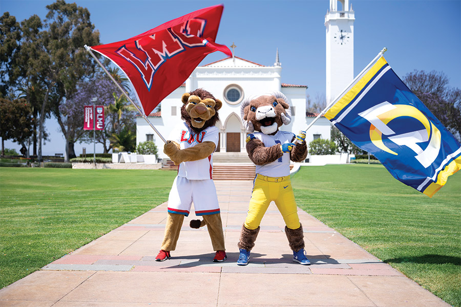 LMU Mascot Iggy the Lion and LA Rams Mascot Rampage holding team flags