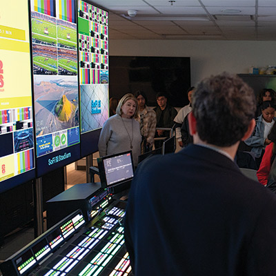 Josh Mark shows LMU students the SoFi Stadium Control Room