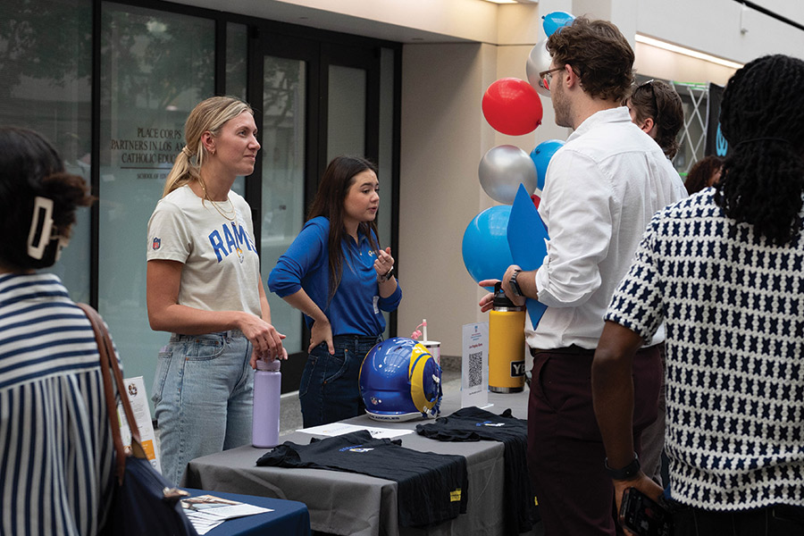 Sasha Carter and Coco Bergdoll speak to guests at LMU Career Fair