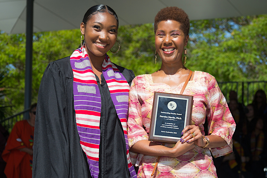 Professor Darnise Martin and graduate at Kente graduation