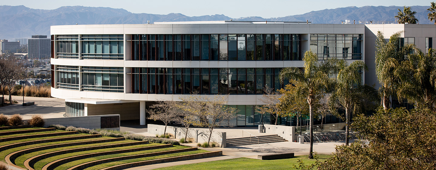 Exterior shot of the William H. Hannon library and the grass area of Lawton Plaza.